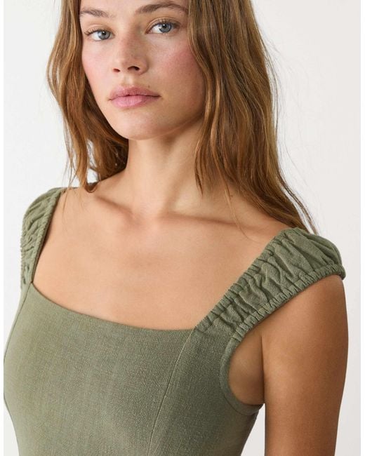 Robe longue en lin mélangé avec liens croisés dans le dos - kaki Stradivarius en coloris Green