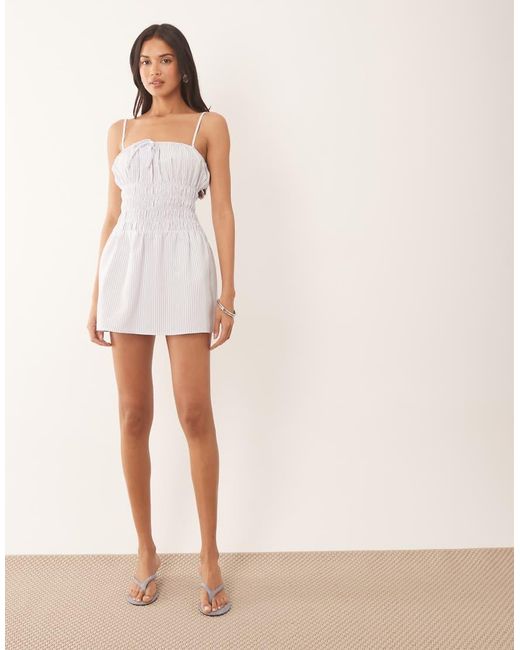 The Frolic White Exclusive Poplin Look Shirred Tie Front Cami Flippy Hem Mini Dress