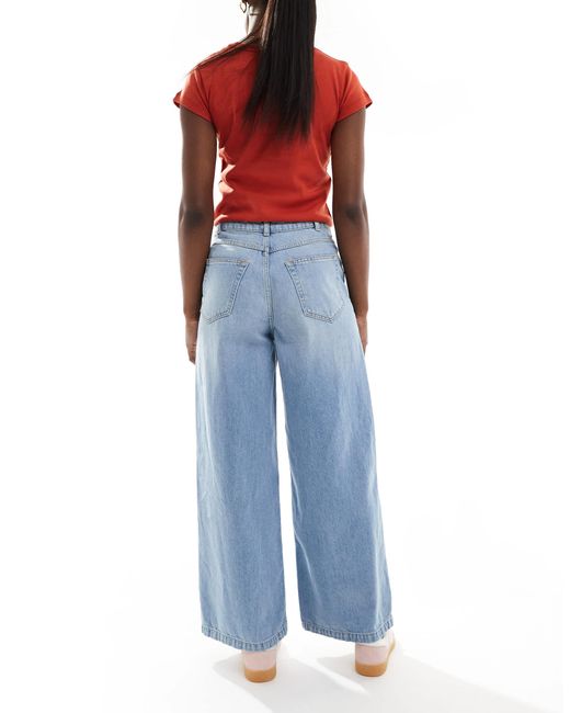 Jean ample court avec poche devant - moyen ASOS en coloris Blue