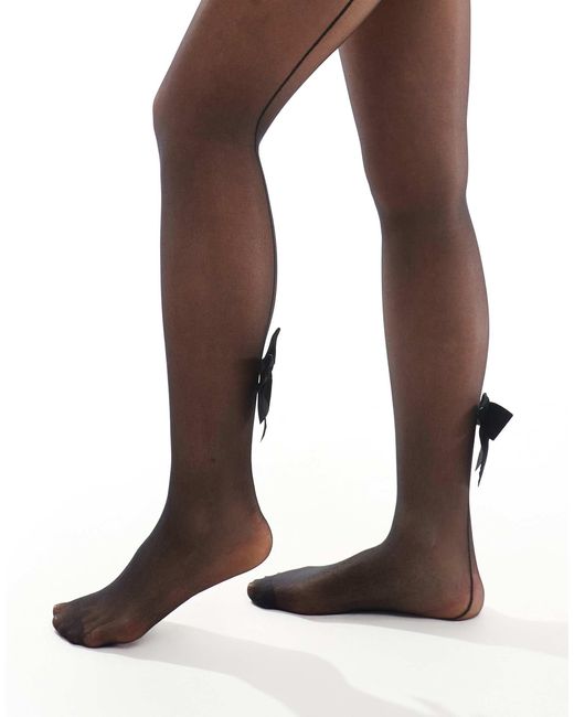 Collants avec nœud à l'arrière Glamorous en coloris Black