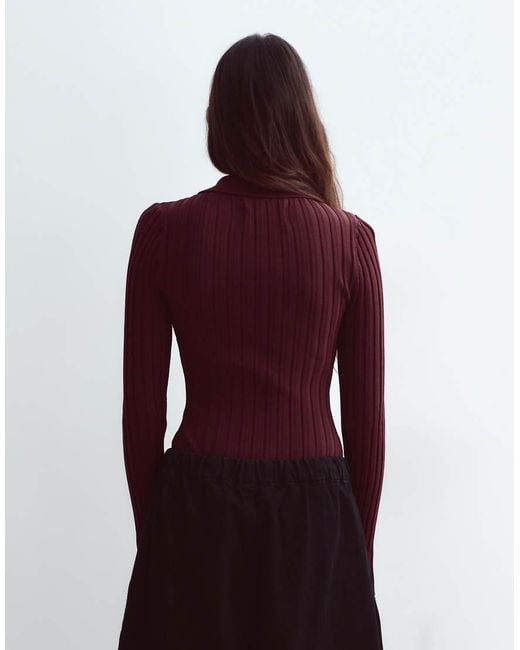 ARRANGE Red Knitted Ribbed Bodysuit With Oversized Button