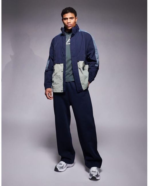 EA7 Blue Armani Panelled Wind Breaker Jacket With Logo Tape Detail for men