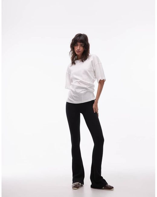 ASOS Seamless Ribbed Flare Legging in White | Lyst UK