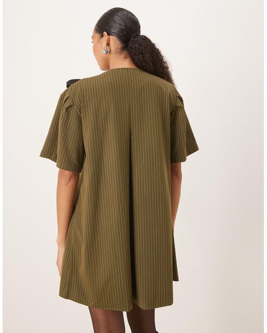 Leighton - robe portefeuille courte à fines rayures Ghospell en coloris Natural