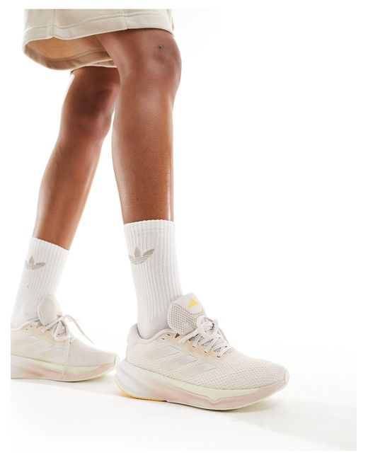 Adidas Originals White Adidas running – supernova stride – sneaker
