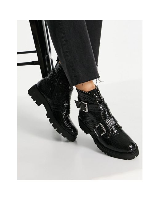 Botas negras planas con efecto cocodrilo, suela gruesa y detalle Steve Madden de color Negro |