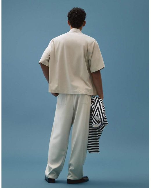 Bershka Blue Fluid Super baggy Darted Trousers for men