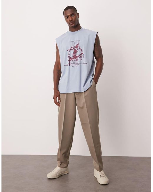 Camiseta Azul Claro Extragrande Sin Mangas Con Sisas Caídas Y Estampado Gráfico Urbano De ASOS de hombre de color Blue