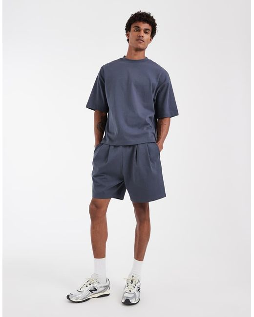 ASOS Blue Circular Design Collection Pleated Oversized Jersey Shorts for men