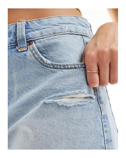 Pantalones cortos vaqueros holgados con diseño rasgado ASOS de color Blue