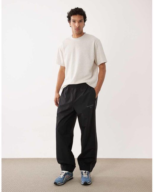 New Balance Black Trackside Woven Pant for men
