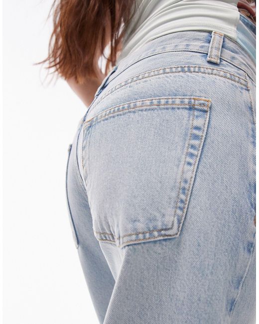 Ember - jeans a vita bassa con fondo ampio candeggiati di TOPSHOP in Blue
