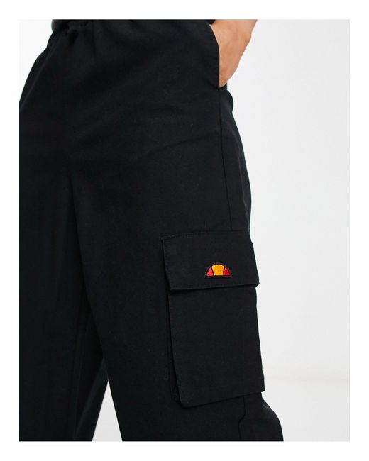 Trazzal - pantaloni sportivi neri oversize di Ellesse in Black