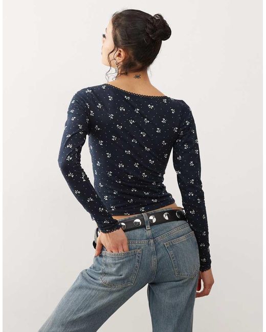 Motel Blue Salisa Mini Bow Print Long Sleeve Top