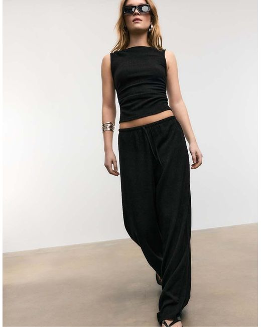 Stradivarius Black Flowing Creased-effect Trousers