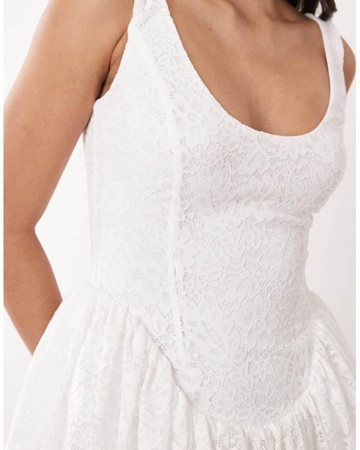 Aria Cove White Lace Scoop Neck Corset Detail Frill Hem Mini Dress