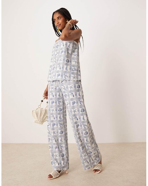 Pantalon d'ensemble ample à imprimé coquillages - bleu ASOS en coloris Natural