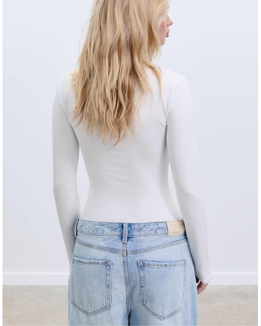 Stradivarius White – langärmliger body aus polyamid