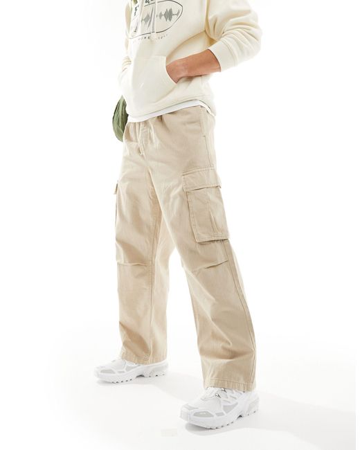 Pantaloni cargo beige con motivo a spina di pesce di Pull&Bear in White da Uomo
