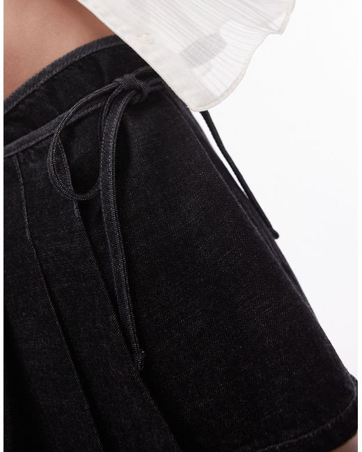 Minifalda crudo estilo kilt con lazada TOPSHOP de color Black