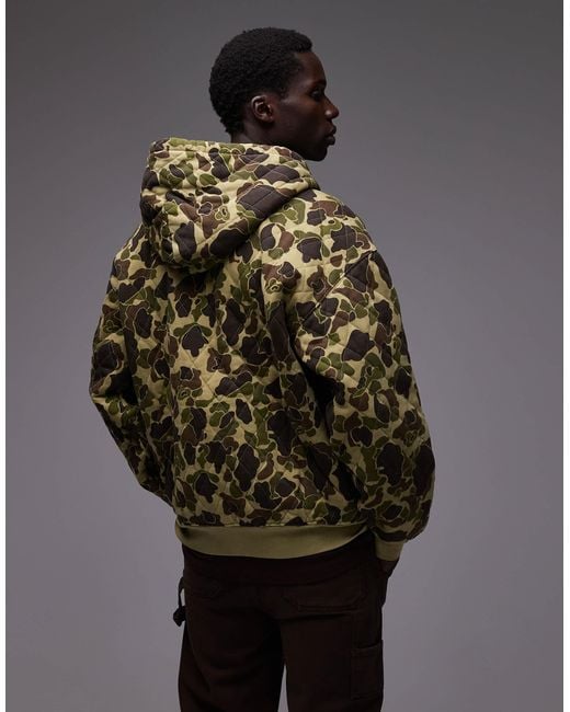 Carhartt – vista – gesteppte oversize-kapuzenjacke mit military-muster in Brown für Herren