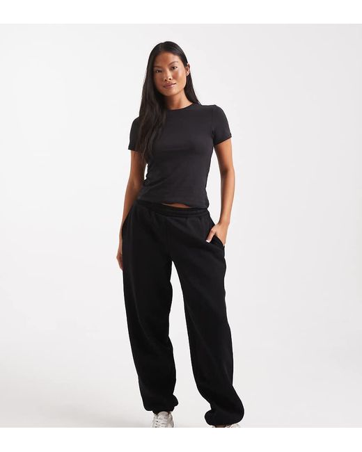 Joggers Negros Con Bajos Ajustados E Interior Afelpado Ultimate De Asos Design Petite ASOS de color Black