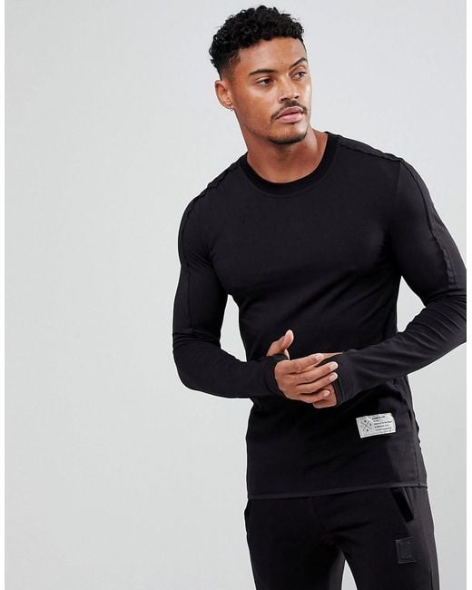Religion Black Long Sleeve Muscle T-shirt With Thumb Hole for men