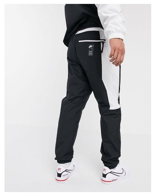Nike Air Cuffed Woven joggers in Black for Men Lyst