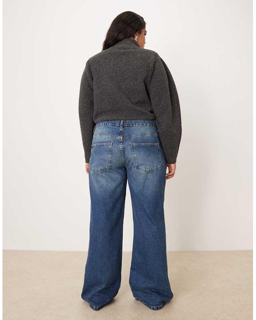 Vaqueros De Corte Holgado Acampanado Con Lavado Oscuro Medio De Asos Design Curve-Azul ASOS de color Blue