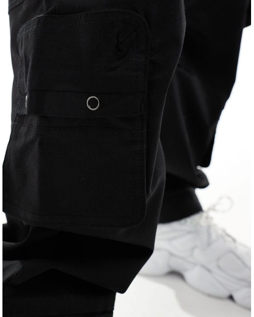 Pantalon cargo à poches multiples Bershka pour homme en coloris Black