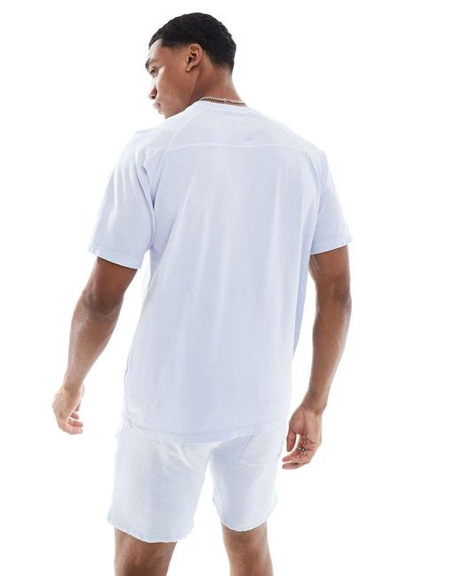 T-Shirt Acido Pesante Con Cuciture A Vista di Another Influence in Blue da Uomo