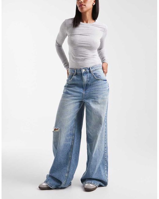 Vaqueros De Pernera Ancha Y Talle Alto Con Lavado Envejecido Tenue Y Detalle De Tira Ajustable De -Azul ASOS de color Blue