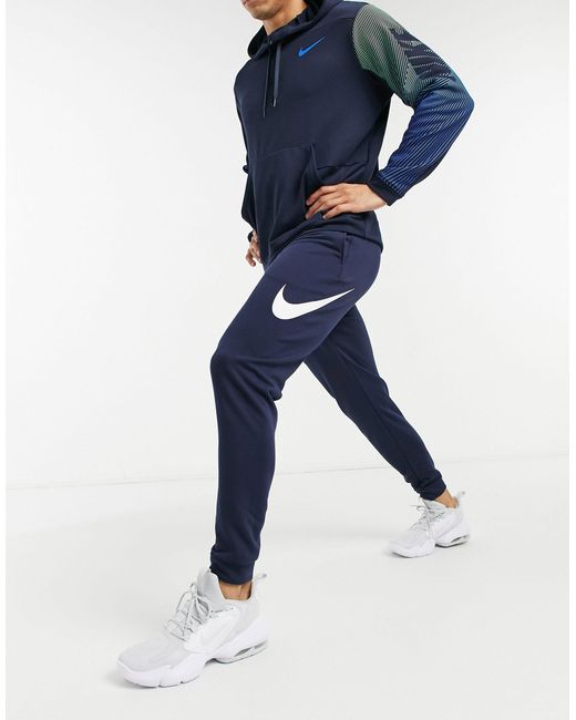 blue nike swoosh joggers
