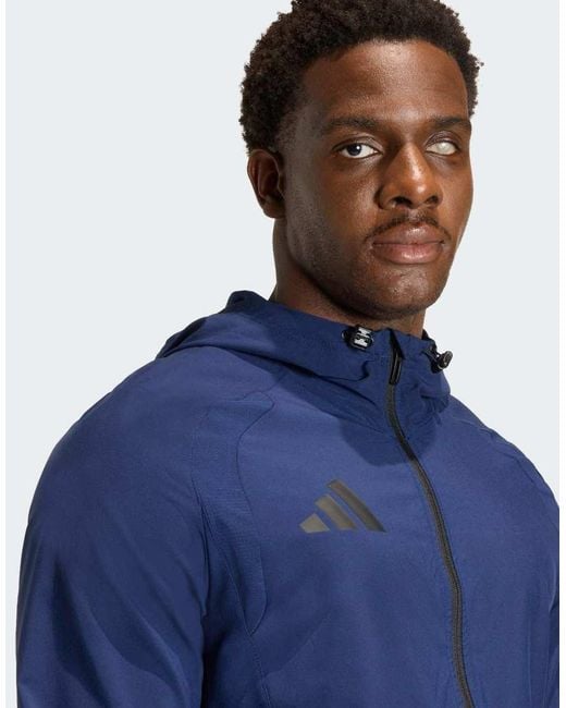 Adidas Originals Blue Tiro Travel Windbreaker Jacket for men