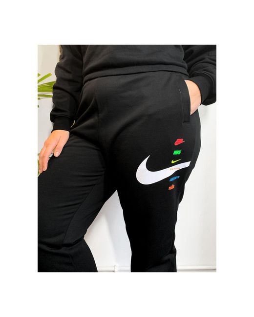 nike trend fleece loose fit cuffed sweatpants in blac