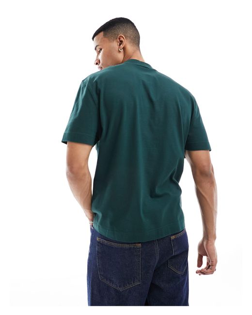 Camiseta verde oscuro con cuello alzado y detalle ASOS de hombre de color Blue