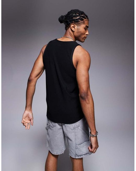 The Couture Club Black Heavyweight Textured Knitted Vest for men