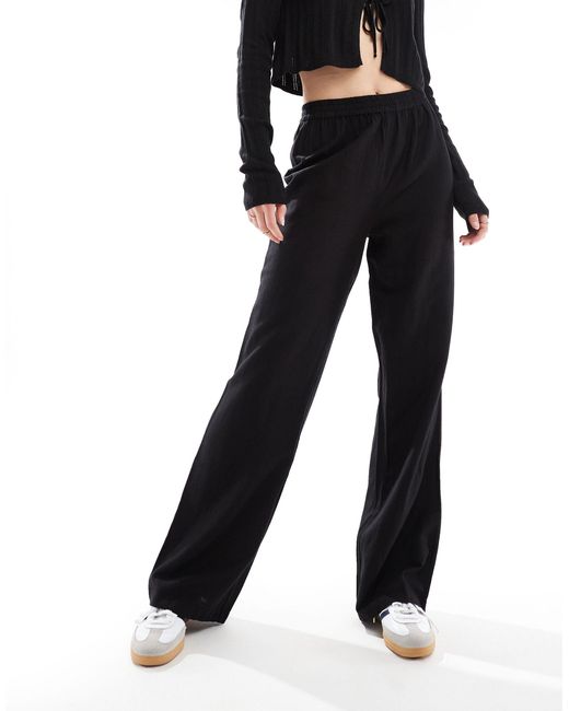 Pantalon large toucher lin Pieces en coloris Black