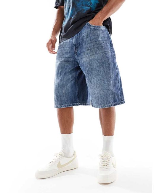 Pantaloncini Di Jeans Ampi Lavaggio Scuro Effetto Invecchiato di Pull&Bear in Blue da Uomo