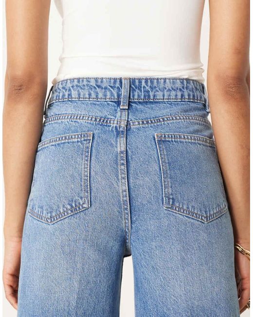 ASOS Asos Design Tall High Waist Wide Leg Jeans With Front Pockets In Mid Blue