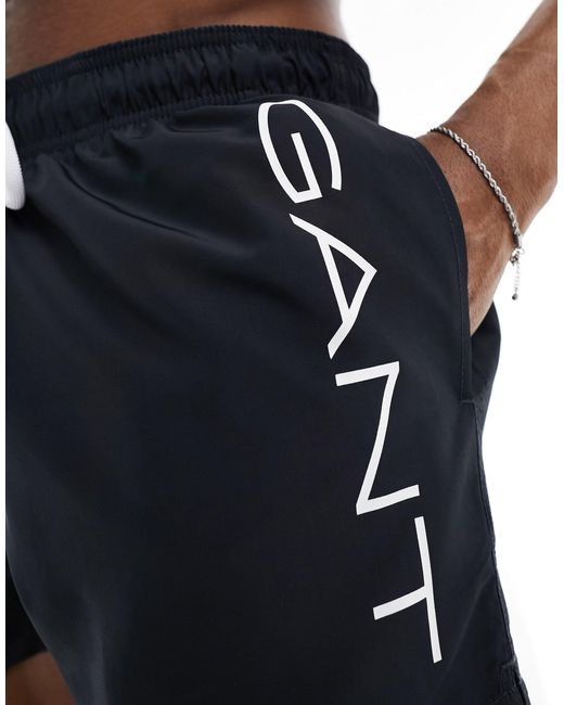 Pantaloncini da bagno neri con scritta laterale del logo di Gant in Black da Uomo