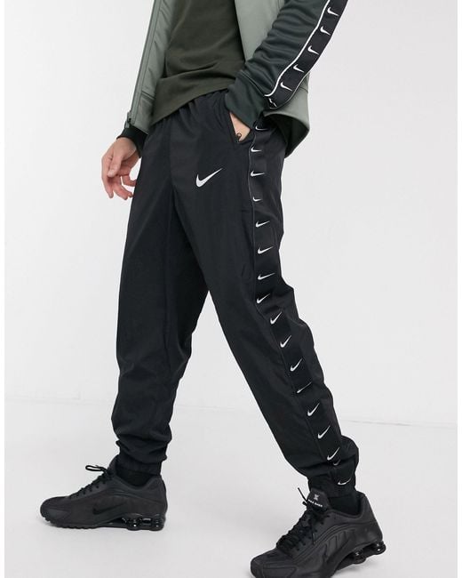 Nike Black Woven Taping Cuffed joggers for men