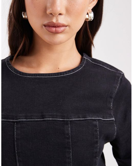 Robe courte structurée en jean avec taille cintrée et manches longues ASOS en coloris Black