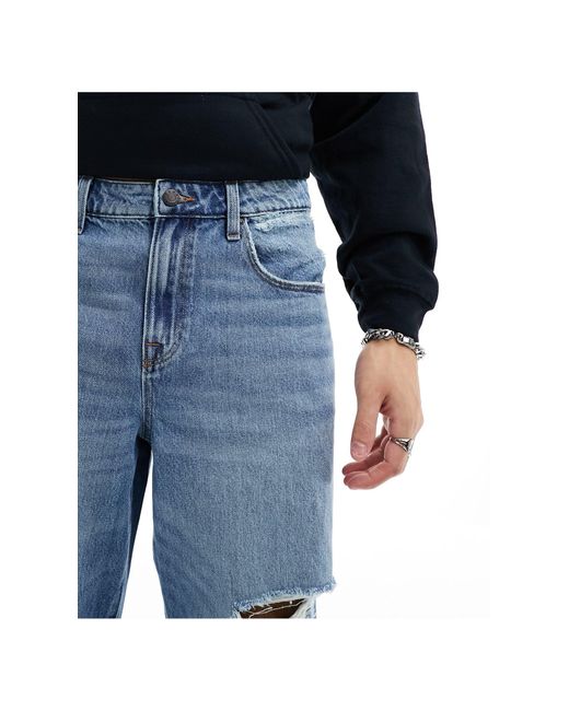 Jeans ampi lavaggio medio con strappi di ASOS in Blue da Uomo