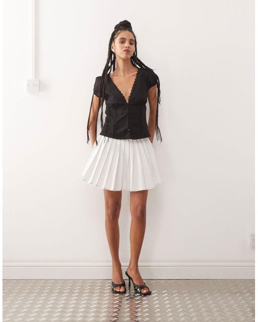 Amy Lynn White ziggy Contrast Pleated Mini Skirt