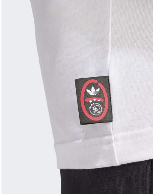 Camiseta Blanca Con Diseño Gráfico Del Ajax De Ámsterdam De Adidas Originals de hombre de color White