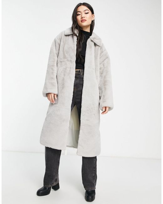 Manteau long en fausse fourrure avec logo virgule - fer et blanc Nike en  coloris Blanc | Lyst