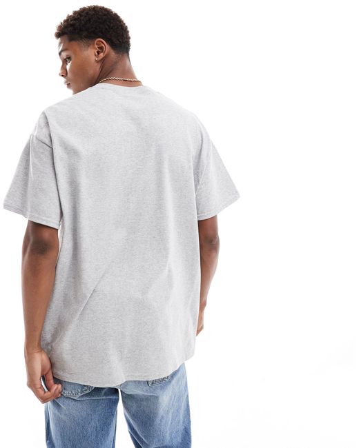 T-shirt oversize avec imprimé sport à l'avant - chiné ASOS pour homme en coloris White