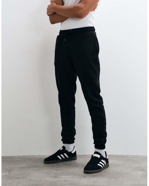 Joggers Negros Básicos De Corte Slim De ASOS de hombre de color Black