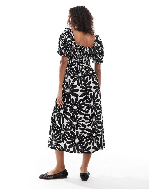Robe tendance folk à manches bouffantes et imprimé fleuri - noir New Look en coloris Black
